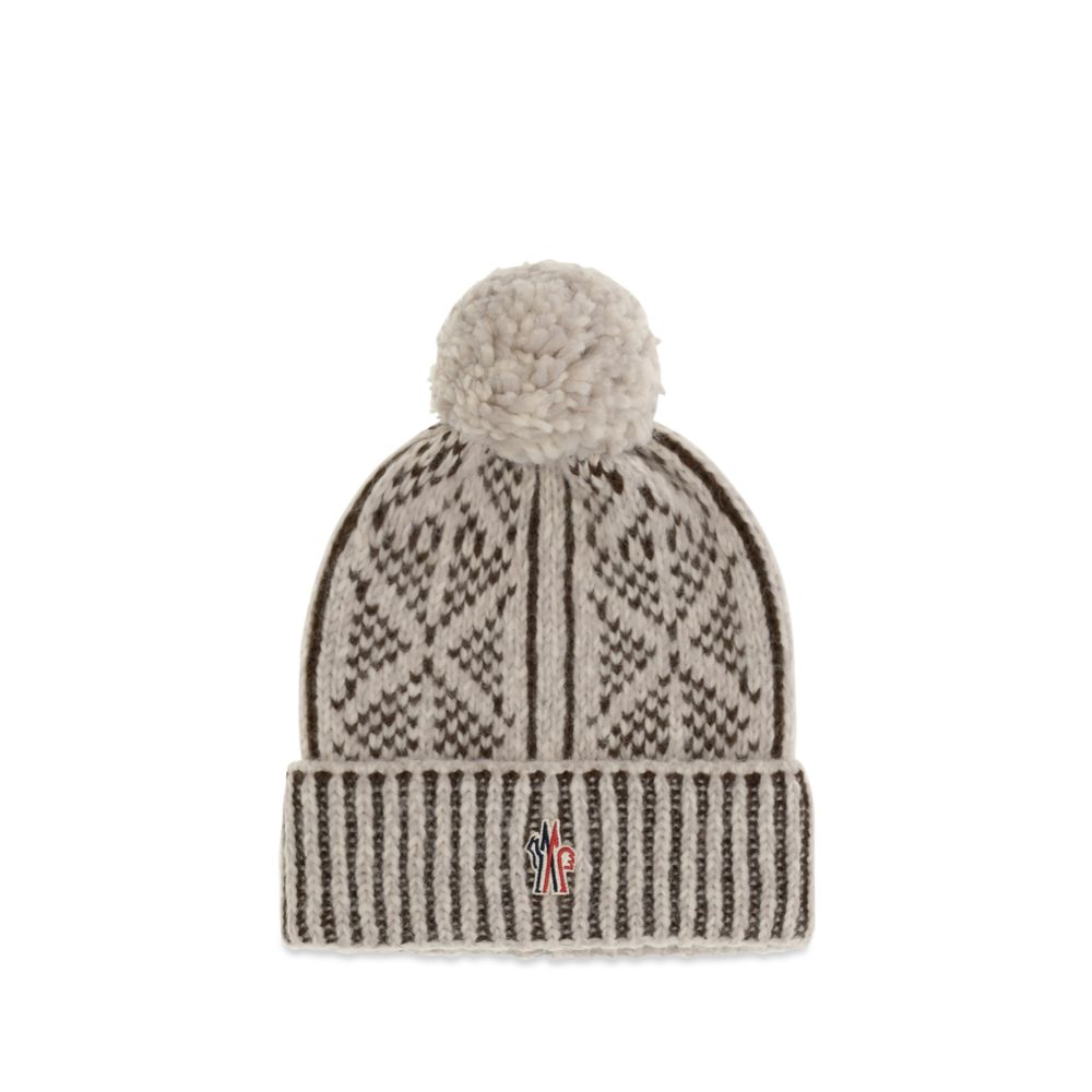 Elevate your winter elegance with the Moncler Grenoble Gray Alpaca Vicugna Pacos Beanie, a luxurious blend of alpaca and wool, embodying alpine-inspired sophistication.