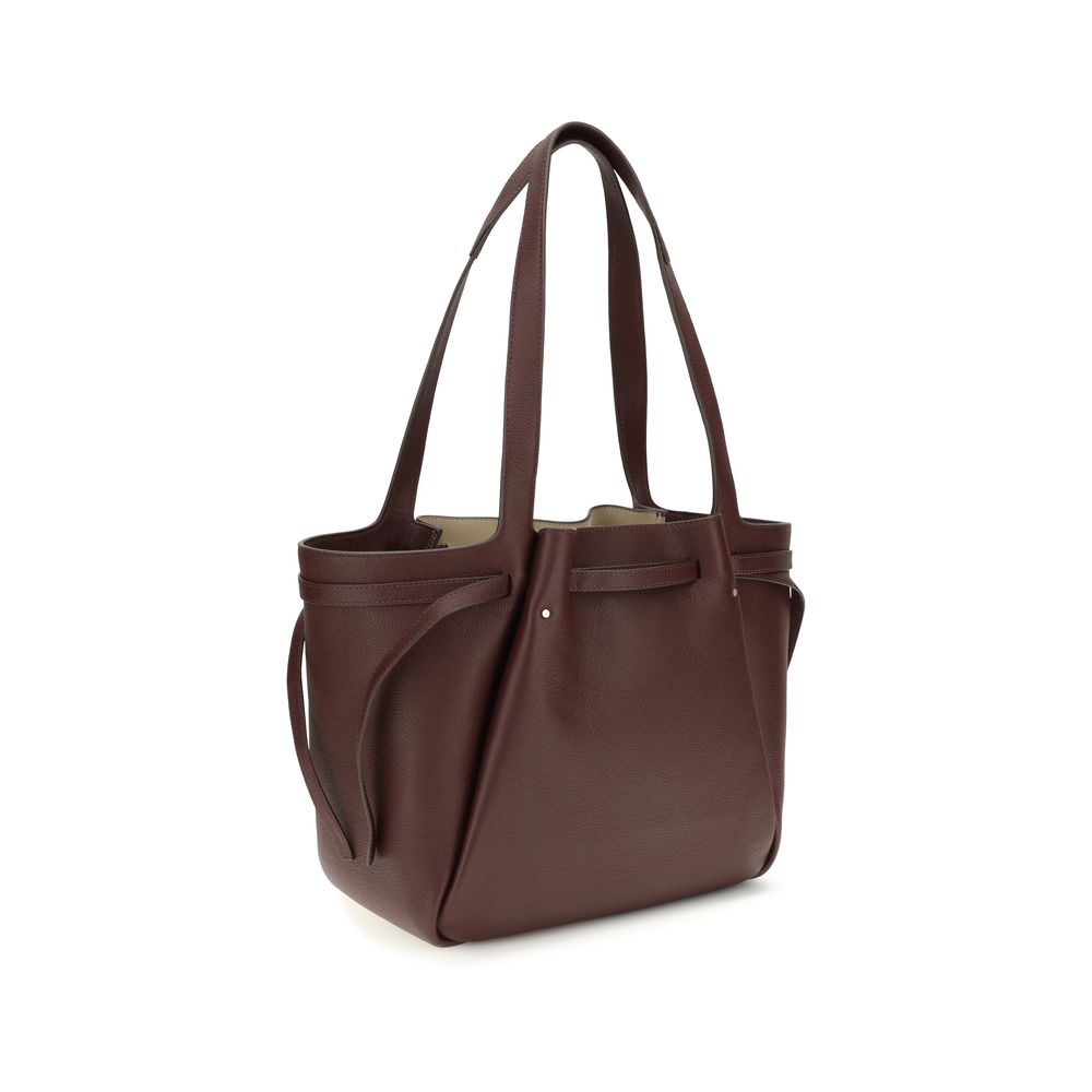 Indulge in the Tory Burch Bordeaux Leather Handbag, a masterpiece of premium craftsmanship and timeless elegance, perfect for the discerning individual seeking sophistication.