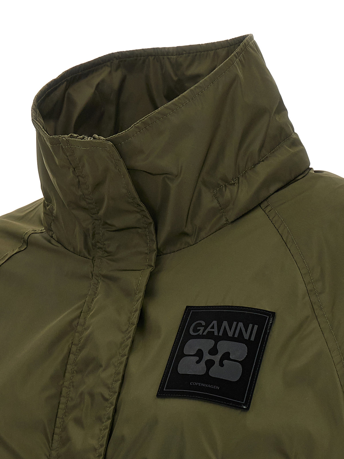 Elevate your wardrobe with the Ganni Bicolor Recycled Polyamide Coat, a sustainable blend of modern design and luxurious comfort, perfect for the discerning fashionista.