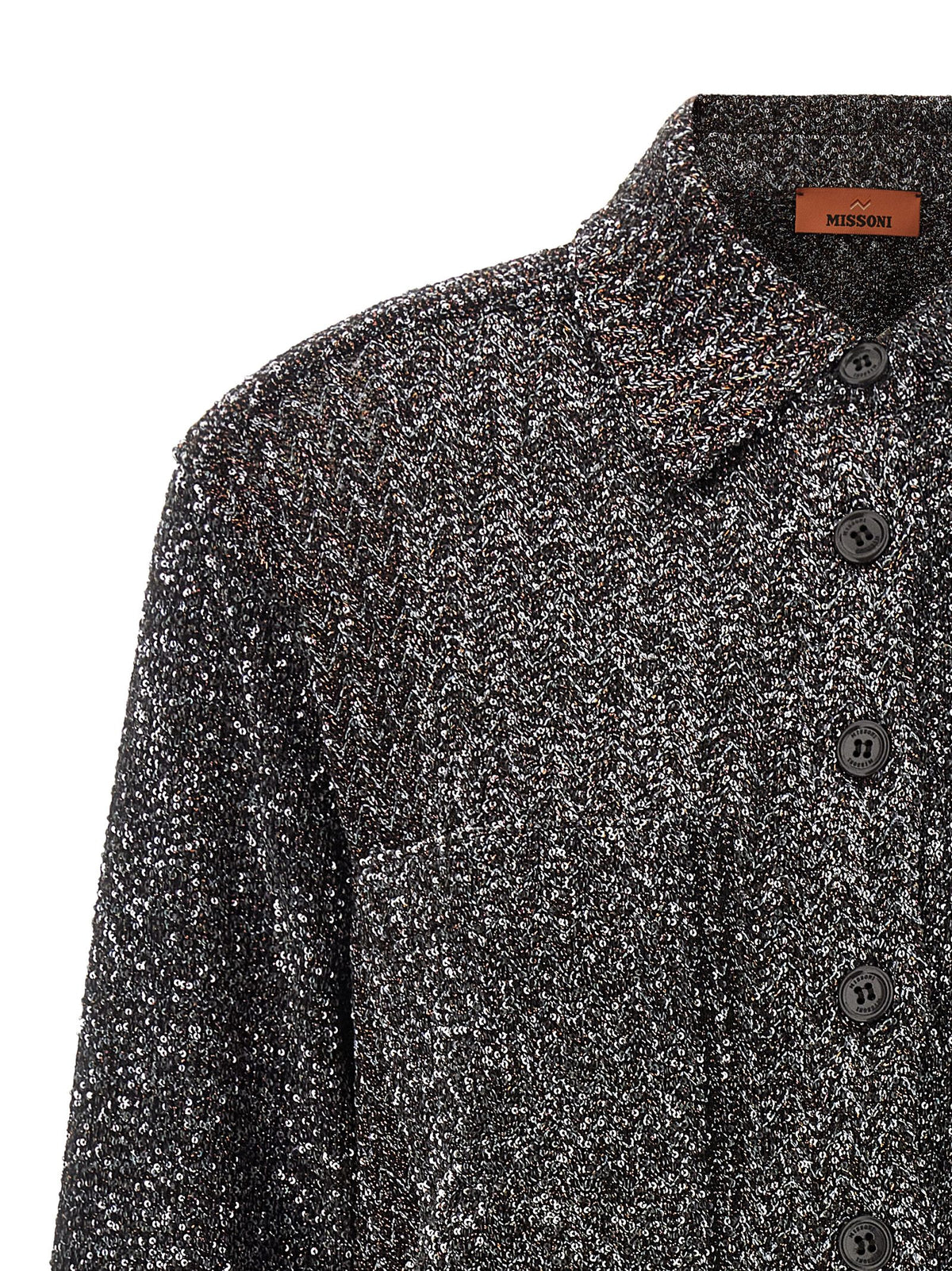 Discover the Missoni Gray Polyamide Blouse, a masterpiece of Italian craftsmanship featuring iconic zigzag motifs and luxurious metallic accents, perfect for timeless elegance.