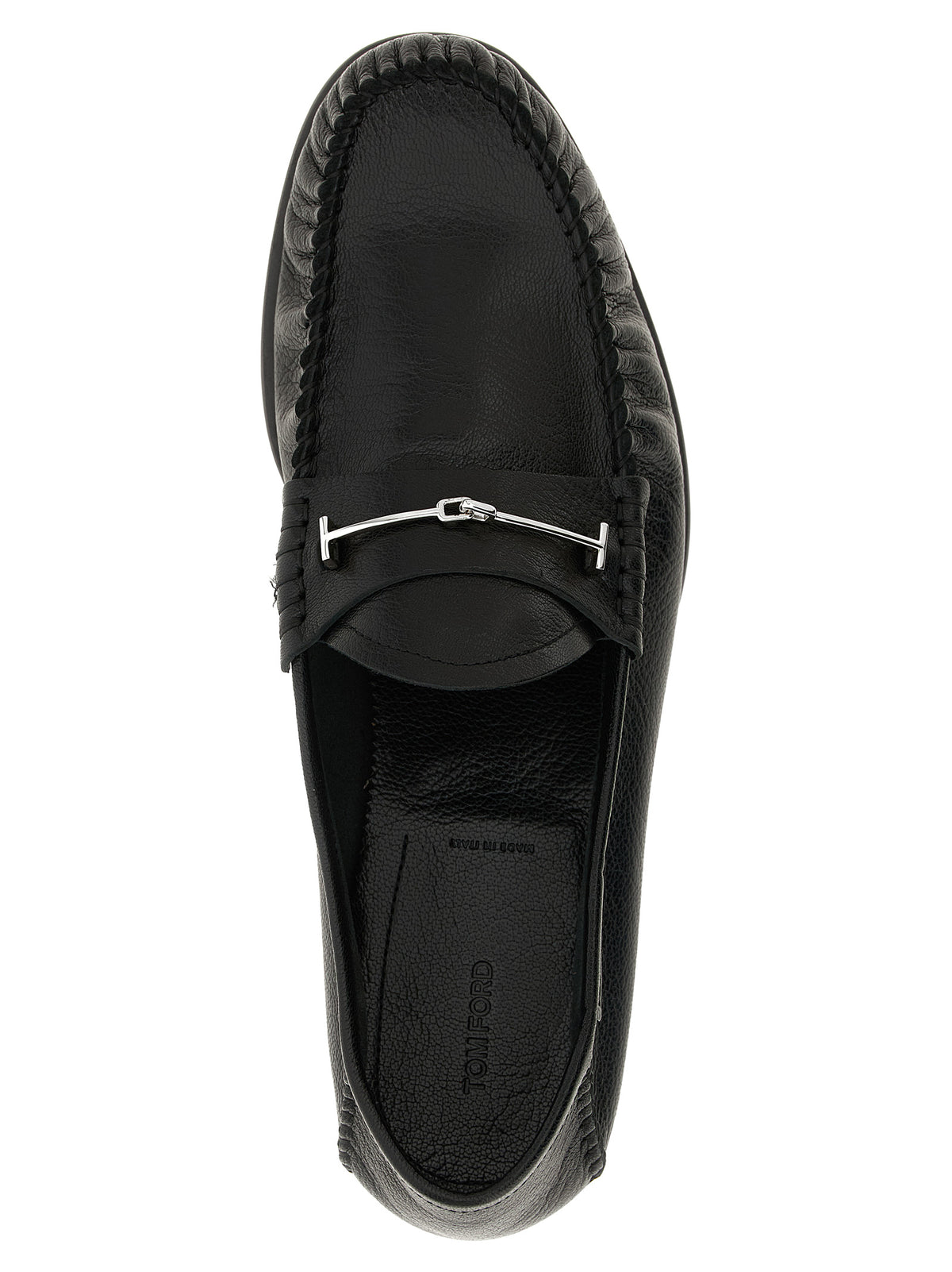 Indulge in the exquisite craftsmanship of Tom Ford's Black Goatskin Slip-On Loafers, where luxurious goat leather meets timeless elegance for the discerning individual.