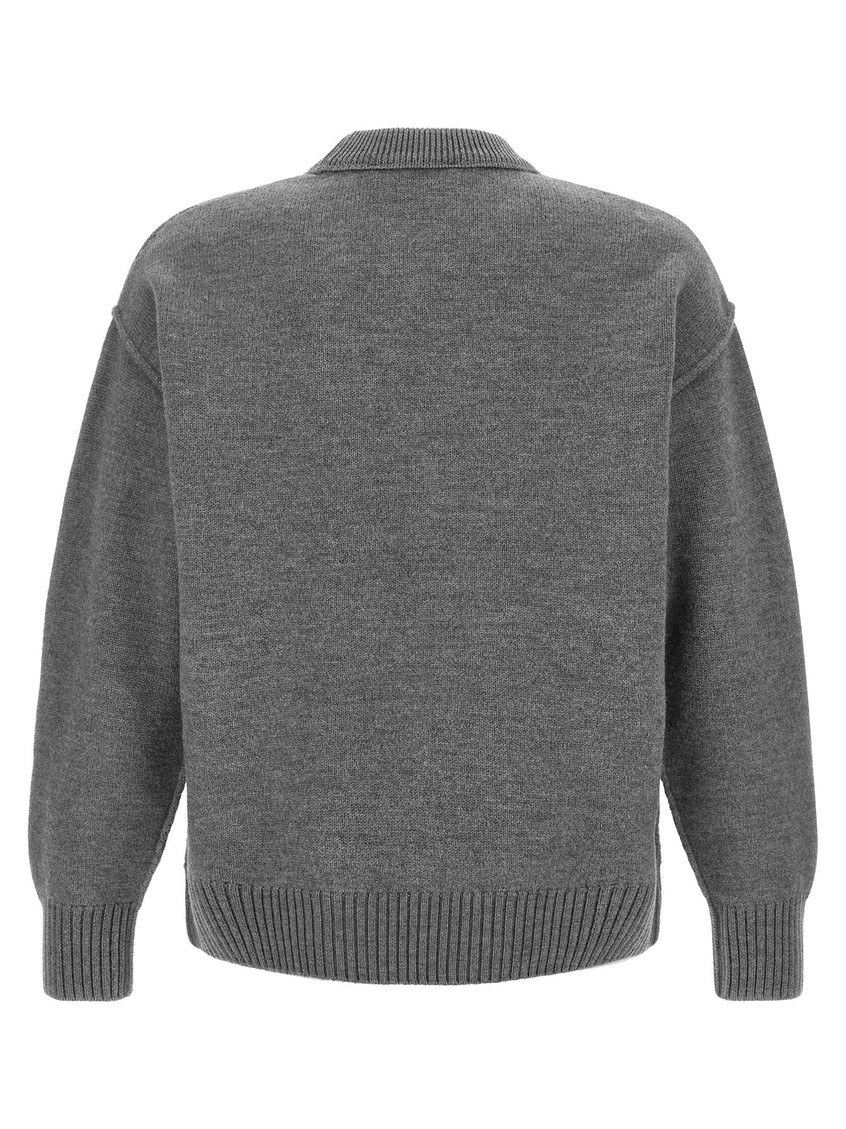 Elevate your wardrobe with the Ami Paris Gray Wool Cardigan, a luxurious 100% wool piece that embodies timeless elegance and sophisticated style for any occasion.