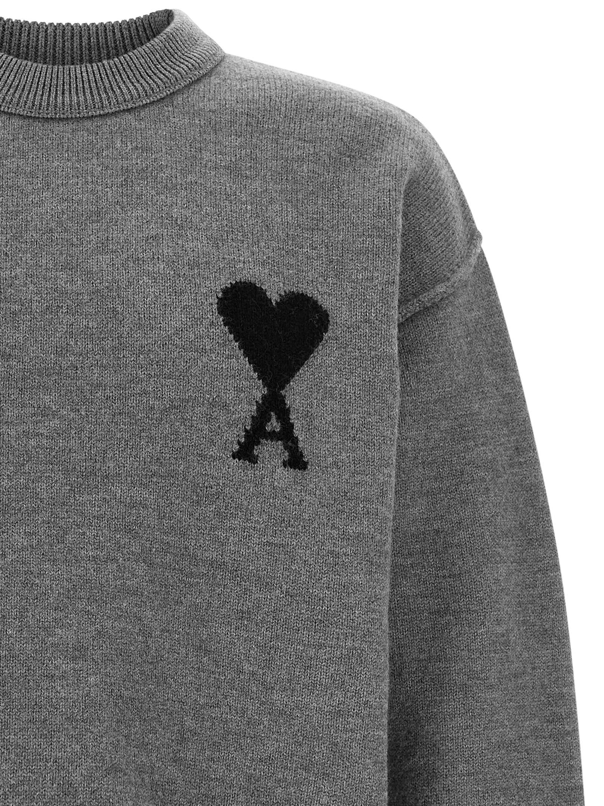 Indulge in the Ami Paris Gray Wool Cardigan, a luxurious blend of 100% wool, epitomizing timeless elegance and effortless sophistication for the discerning wardrobe.