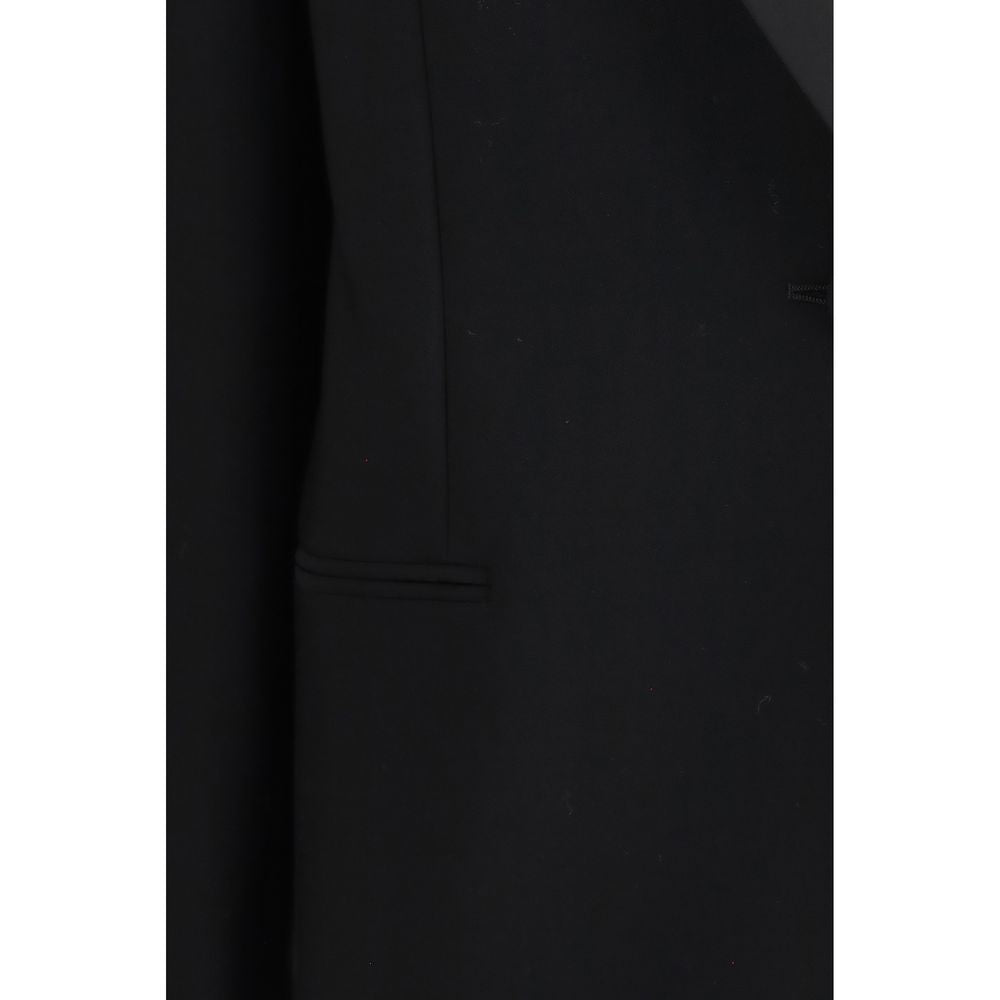 Elevate your wardrobe with The Row's Black Wool Oves Aries Blazer, a masterpiece of tailored elegance crafted from premium fleece wool, perfect for the discerning individual.
