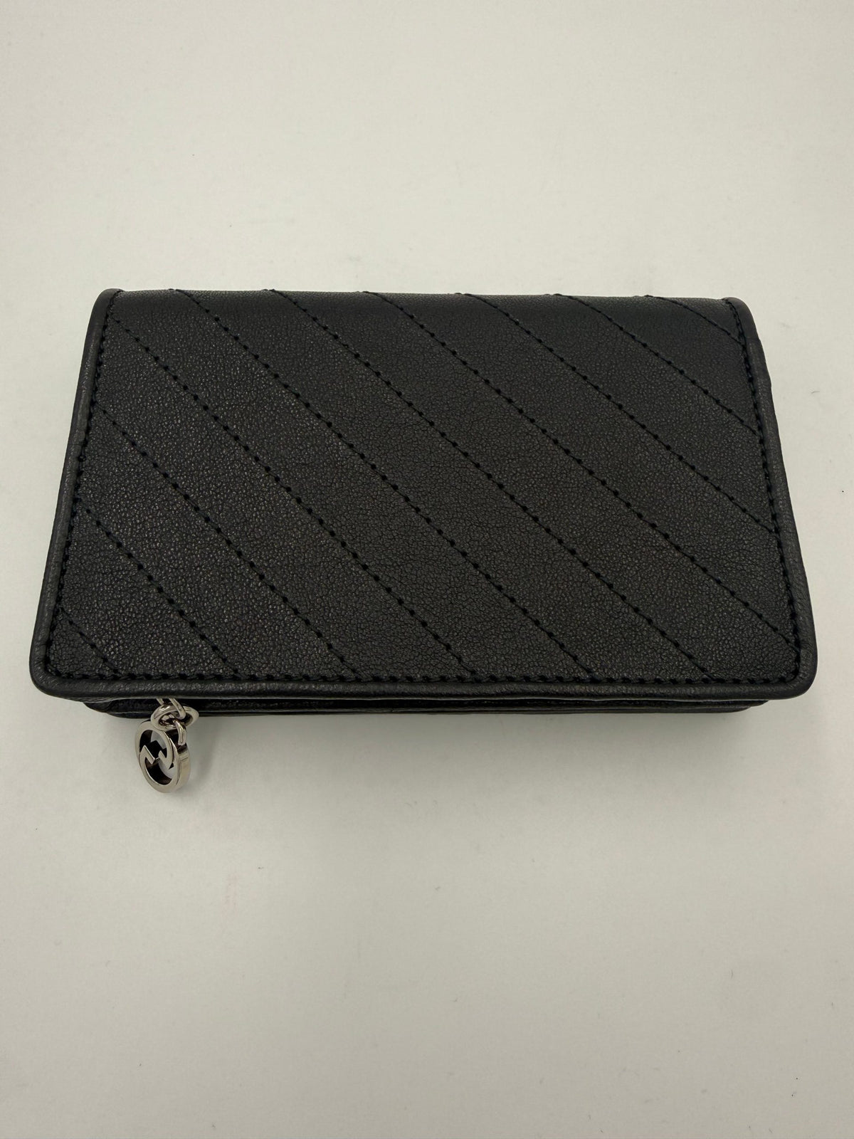 Experience the exquisite allure of the Gucci GG Blondie Wallet, a luxurious blend of brushed calf leather and timeless design, perfect for the discerning individual.