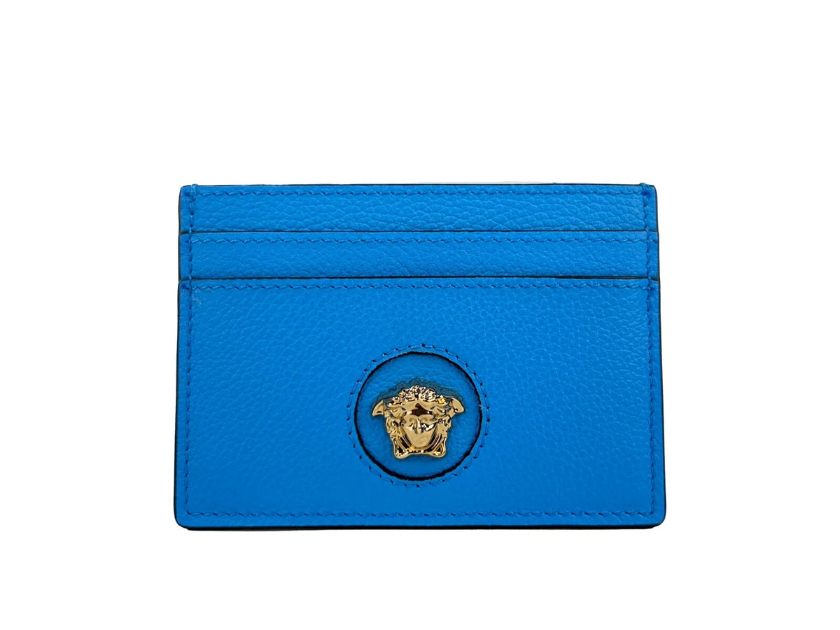 Elevate your elegance with the Versace Mini Medusa Blue Grainy Leather Slim Card Case Wallet, a masterpiece of craftsmanship that embodies luxury and sophistication for the discerning individual.