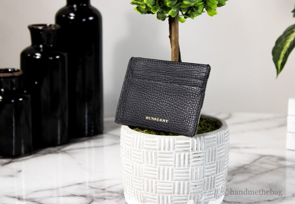 Elevate your style with the Burberry House Check Chase Money Clip Card Case, a luxurious blend of pebbled leather and canvas, designed for the discerning individual.