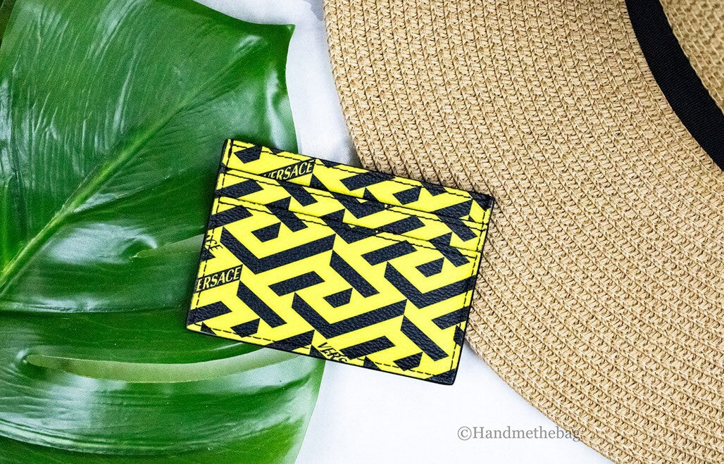 Elevate your accessory game with the Versace La Greca Pineapple Card Case Wallet, a masterpiece of coated canvas that embodies luxury and sophistication for the discerning individual.