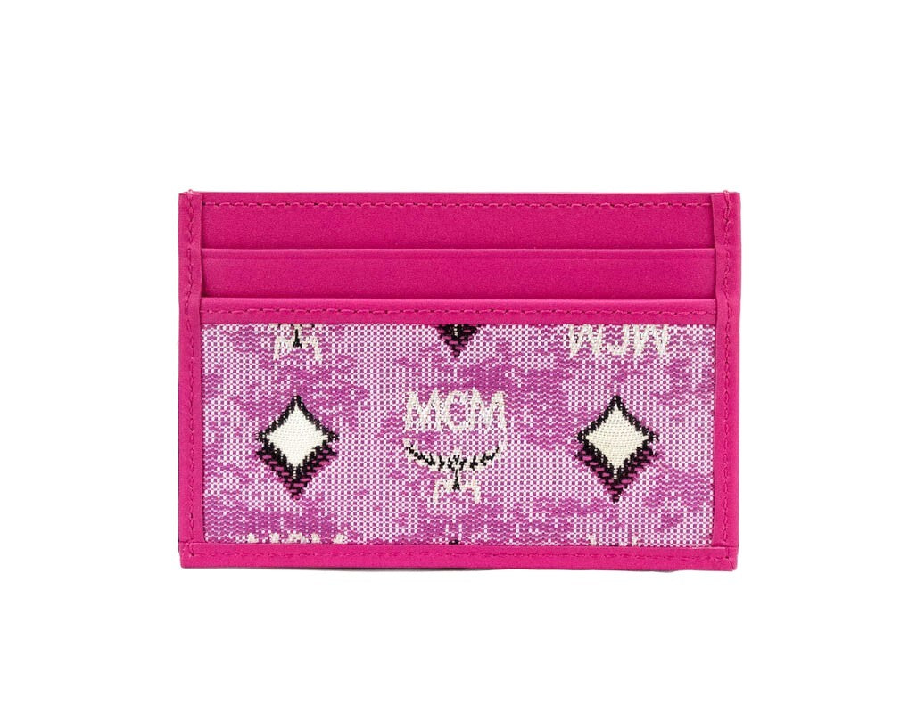 Indulge in the MCM Veritas Vintage Pink Denim Fabric Monogrammed Card Case Wallet, a masterpiece of craftsmanship and elegance, perfect for the discerning individual.