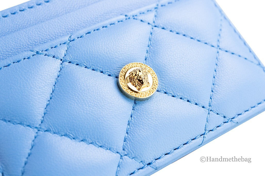 Elevate your elegance with the Versace Mini Medusa DV Blue Quilted Card Case, a masterpiece of smooth nappa leather, offering exquisite craftsmanship and timeless allure.