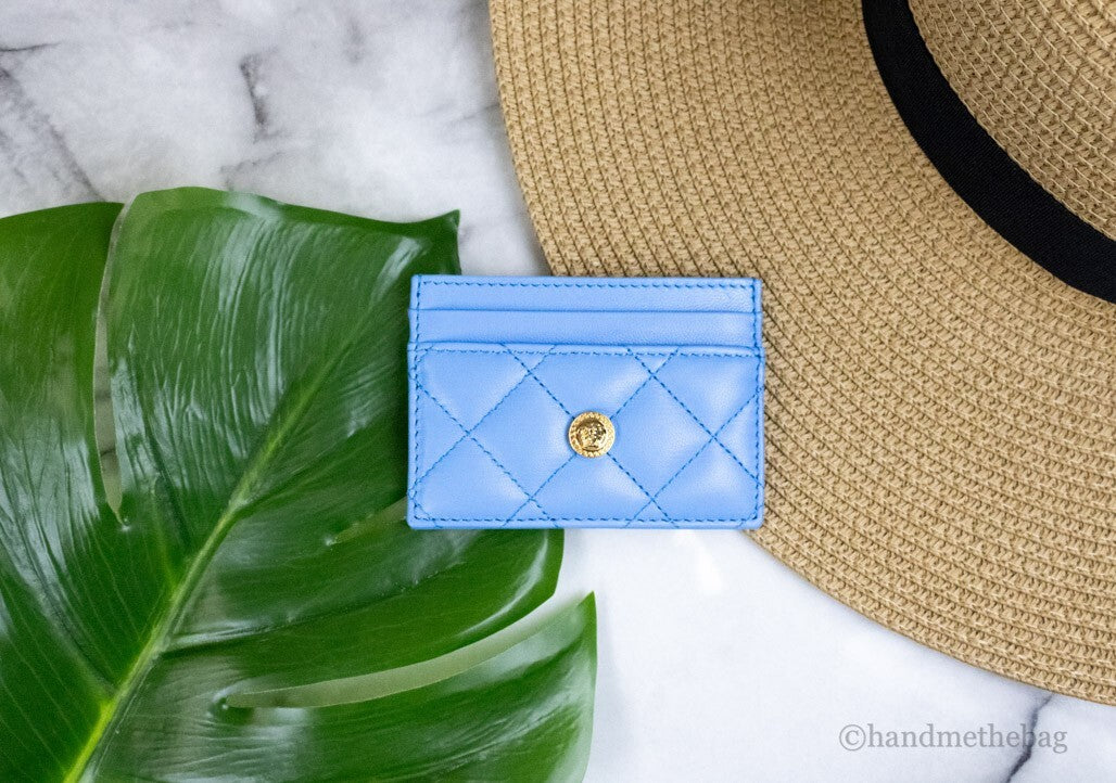 Elevate your elegance with the Versace Mini Medusa DV Blue Quilted Leather Card Case, a luxurious blend of exquisite craftsmanship and timeless sophistication.