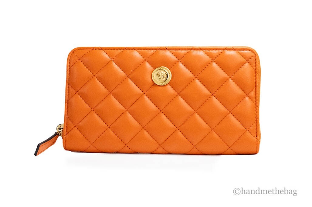 Indulge in the Versace Large Dark Orange Quilted Smooth Leather Continental Clutch, a masterpiece of luxury and craftsmanship, perfect for elevating your style.