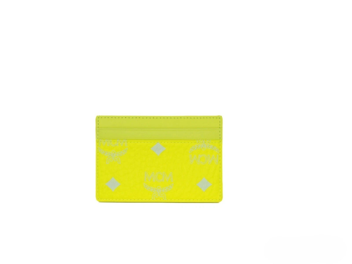 Elevate your elegance with the MCM Neon Yellow Visetos Diamond Logo Card Case, a luxurious blend of coated canvas and nappa leather, perfect for the discerning individual.