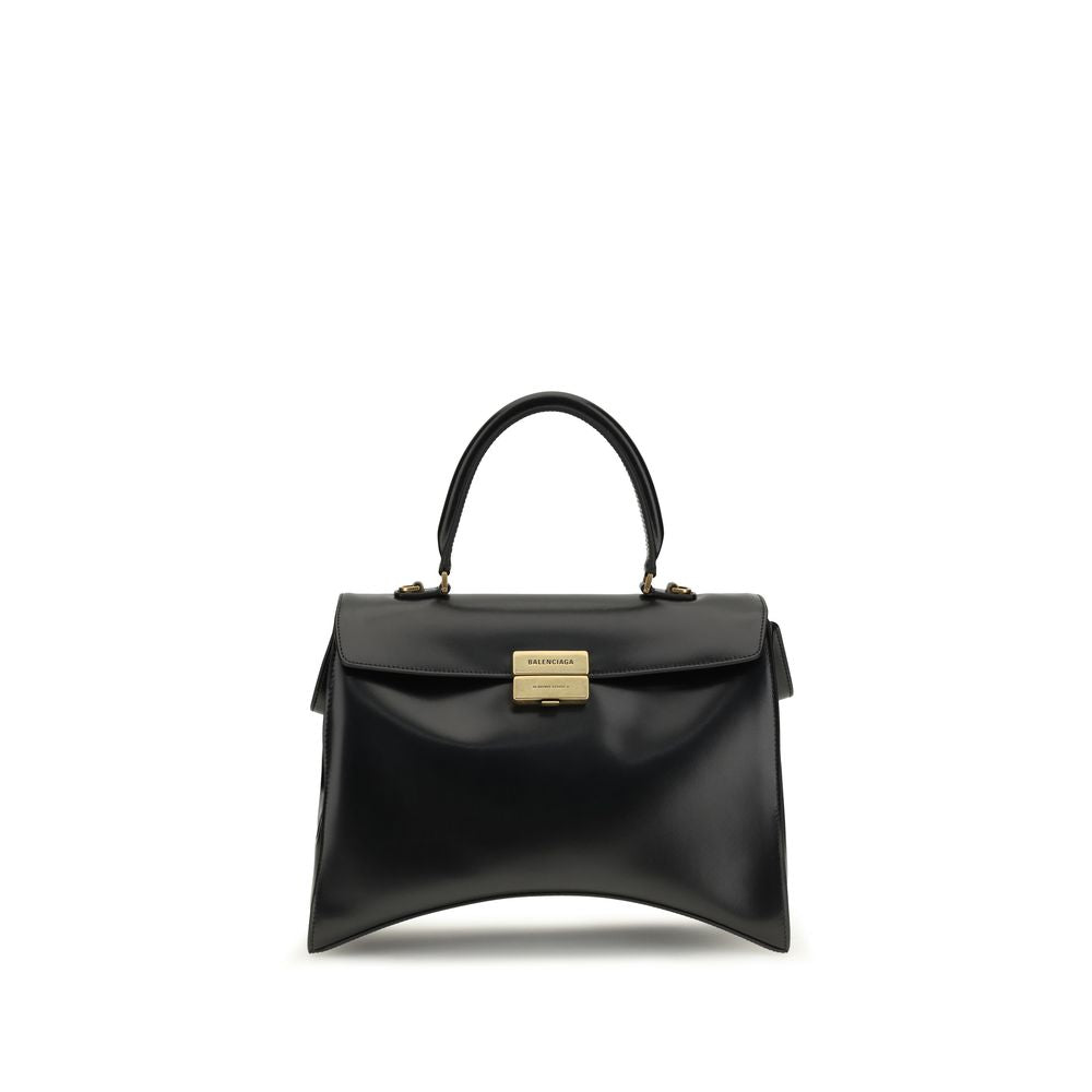 Discover the Balenciaga Black Calf Leather Bos Taurus Shoulder Bag, a sculptural masterpiece of glossy calfskin, embodying luxury and sophistication for the discerning individual.