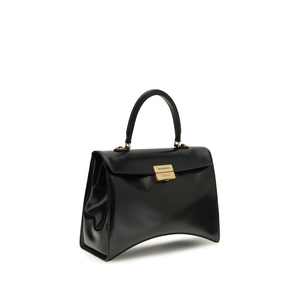 Discover the Balenciaga Black Calf Leather Bos Taurus Shoulder Bag, a sculptural masterpiece of glossy box calfskin, embodying timeless luxury and exquisite craftsmanship for the discerning individual.