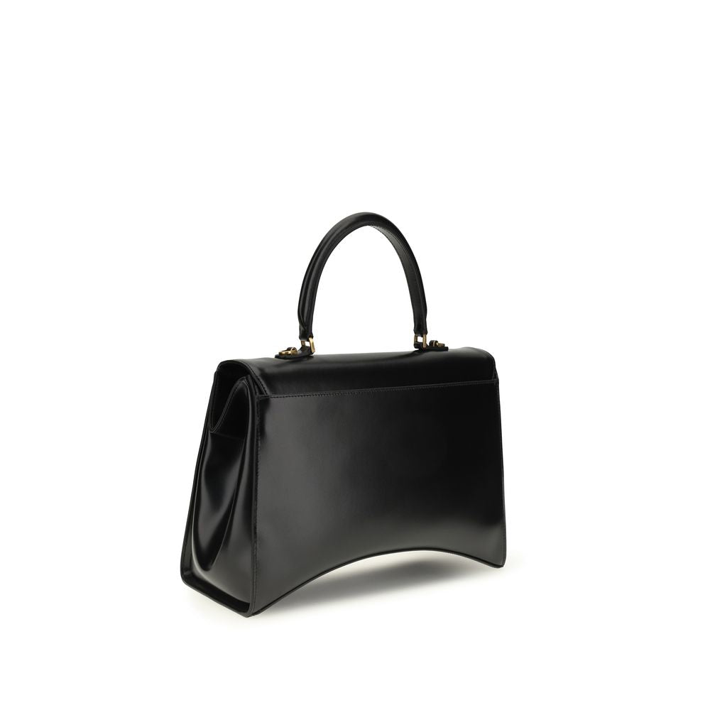Discover the Balenciaga Black Calf Leather Bos Taurus Shoulder Bag, a sculptural masterpiece of glossy box calfskin, embodying timeless elegance and sophisticated allure.
