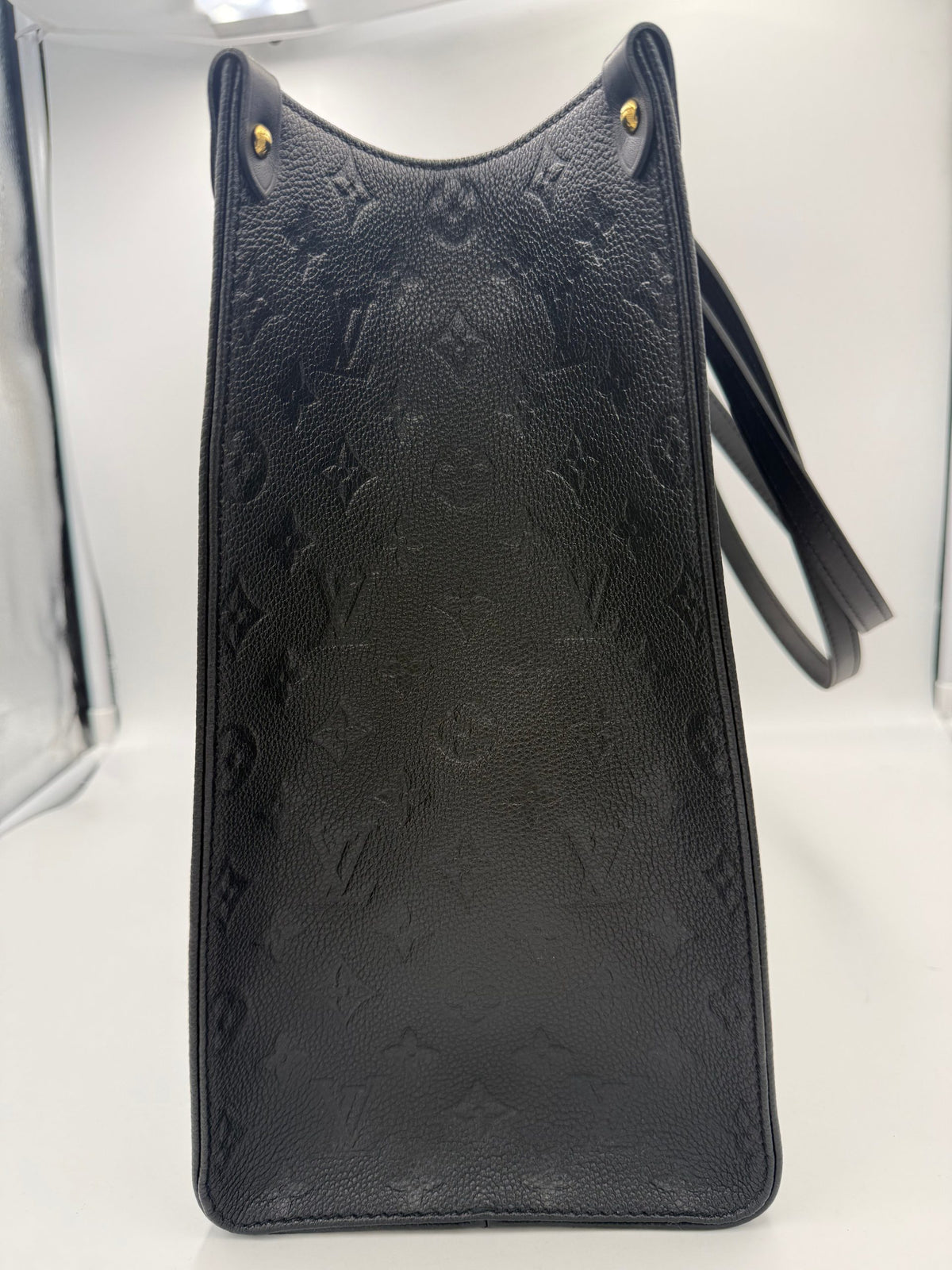 Discover the Louis Vuitton ON THE GO Empreinte GM Handbag, a symbol of luxury and sophistication, meticulously crafted for those who appreciate timeless elegance.