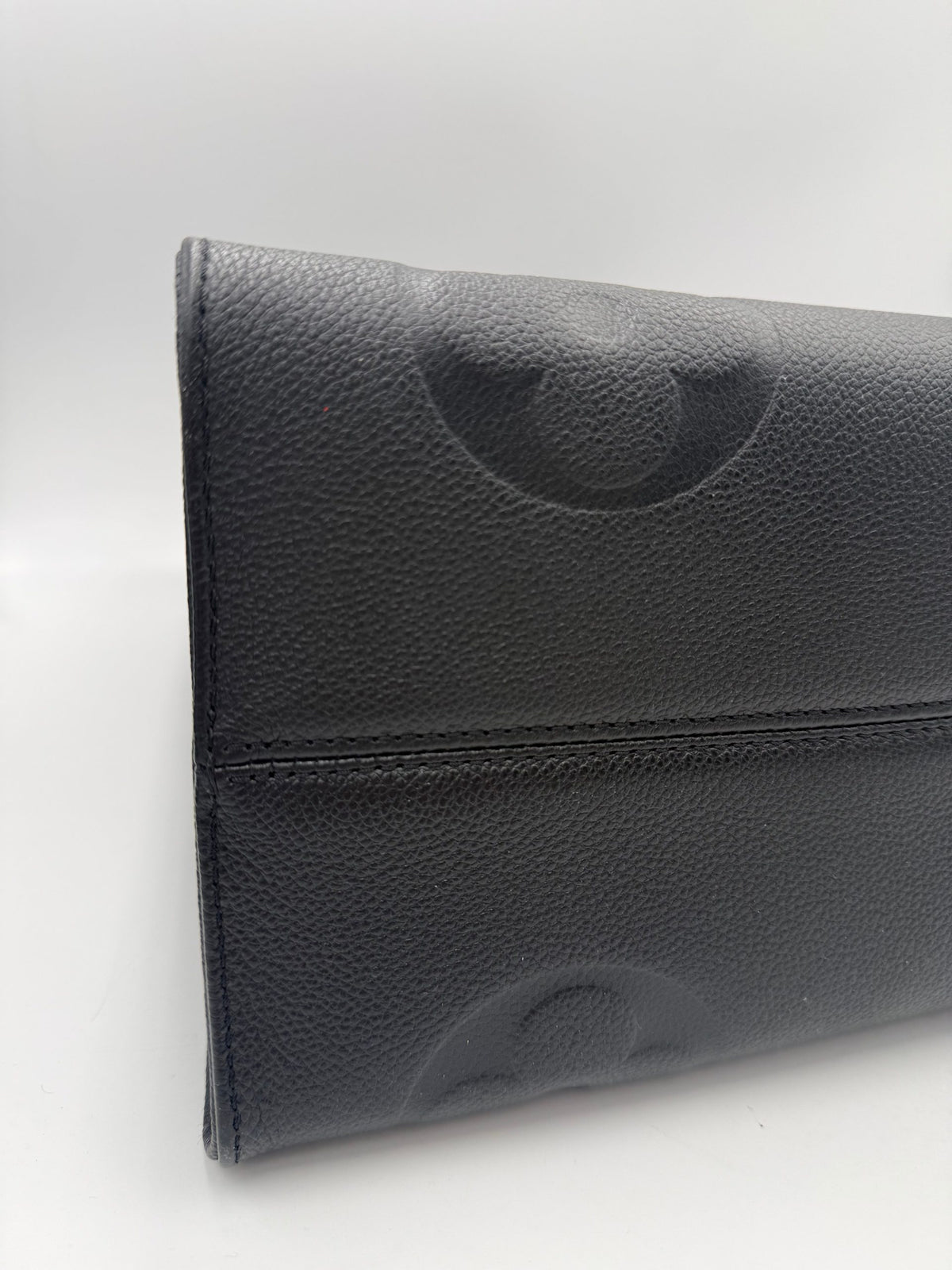 Elevate your style with the Louis Vuitton ON THE GO Empreinte GM Handbag, a luxurious blend of exquisite craftsmanship and timeless elegance, perfect for any occasion.