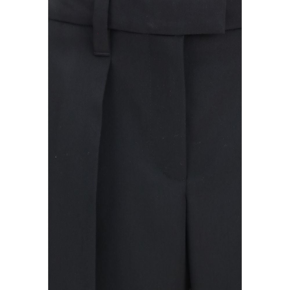 Elevate your wardrobe with Brunello Cucinelli's Black Wool Oves Aries Dress Pants, crafted from luxurious fleece wool for timeless elegance and refined sophistication.