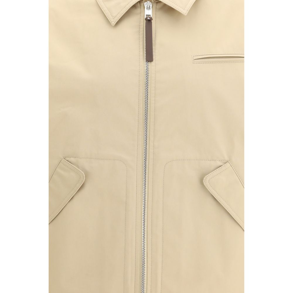 Discover the Moschino Beige Cotton Full-Length Jacket, a masterpiece of SS26 elegance, crafted from 100% cotton for the discerning individual who values sophistication and style.