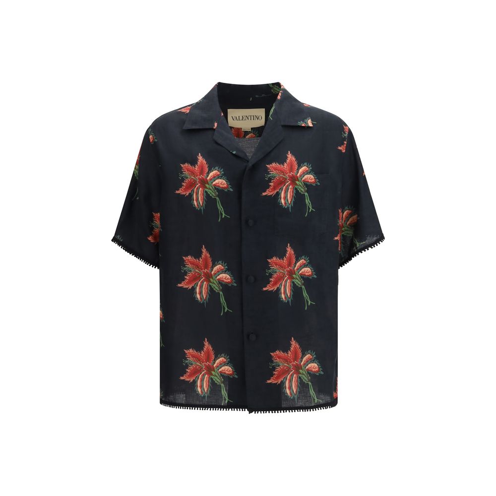Elevate your wardrobe with the Valentino Garavani Black Linen Pattern Shirt, a masterpiece of 100% linen adorned with iconic Papier Floral prints, embodying effortless luxury and timeless elegance.