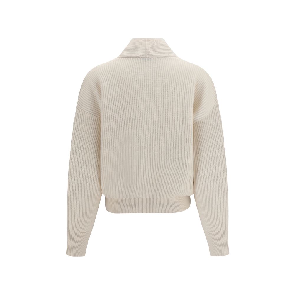 Experience the allure of the Brunello Cucinelli Beige Cashmere Cardigan, a masterpiece of luxury knitwear that embodies sophisticated elegance and meticulous craftsmanship.