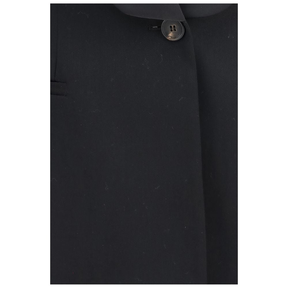 Discover the Brunello Cucinelli Black Wool Oves Aries Full-Length Jacket, a masterpiece of 100% Fleece Wool Ovis Aries, embodying timeless elegance and exquisite craftsmanship for the discerning individual.