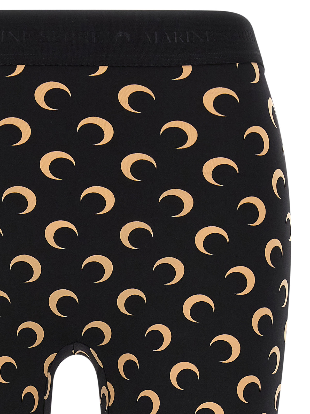 Indulge in the elegance of Marine Serre's Beige Polyamide Leggings, crafted from recycled materials, merging sustainability with high fashion for a timeless statement.