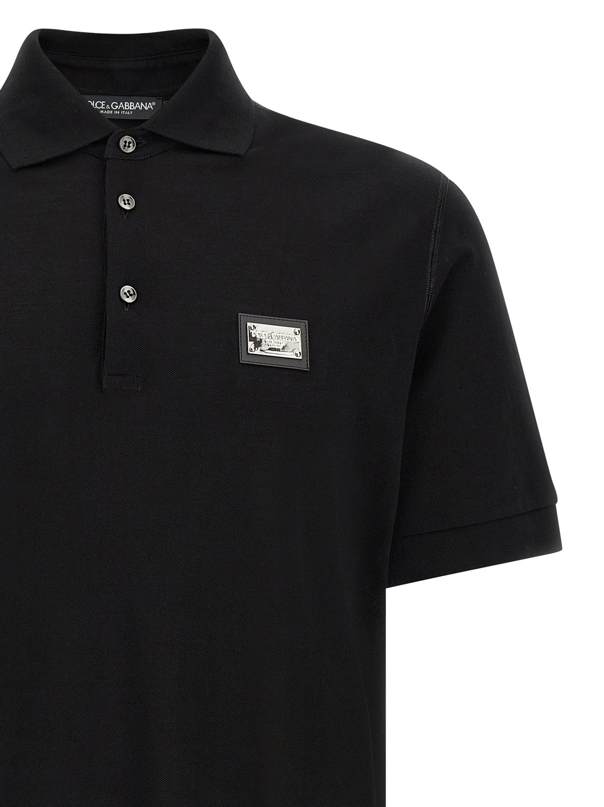 Indulge in the exquisite Dolce & Gabbana Black Cotton Polo Shirt, a timeless piece crafted from luxurious 100% cotton, embodying sophistication and modern elegance.