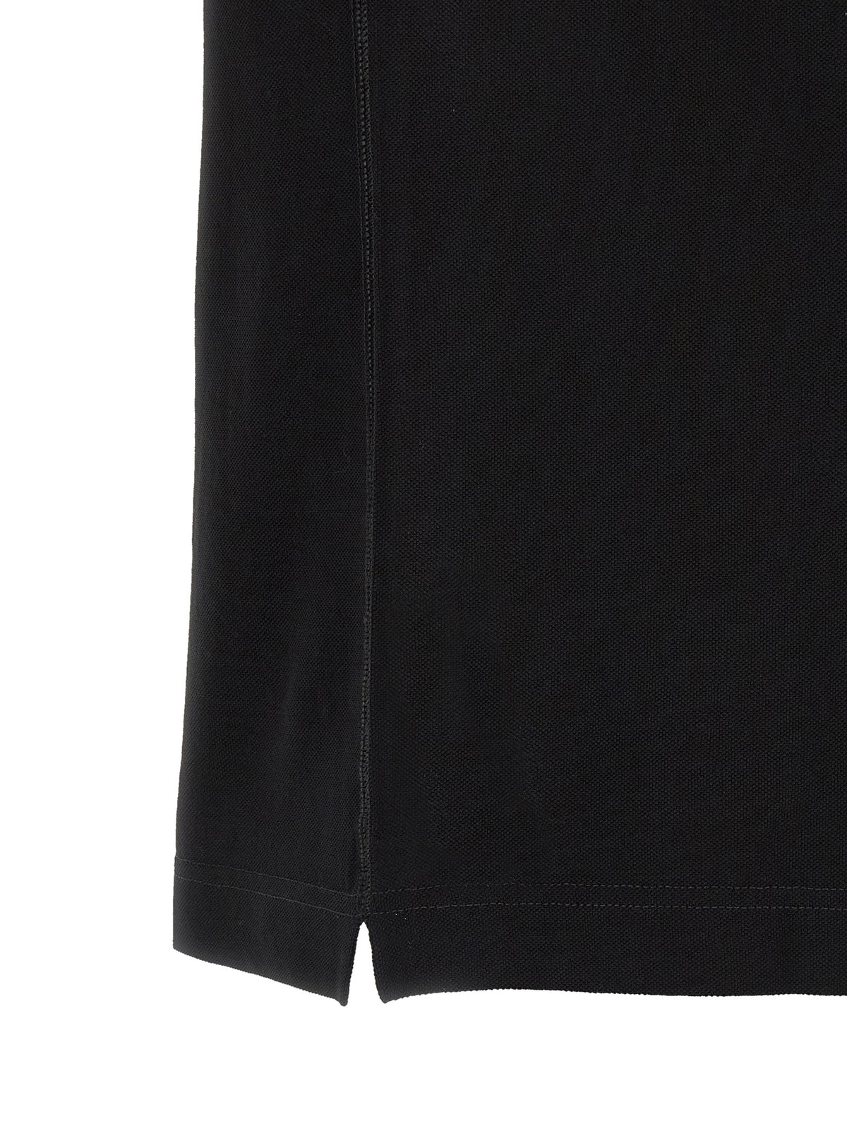 Indulge in the exquisite Dolce & Gabbana Black Cotton Polo Shirt, a timeless luxury crafted from premium Italian cotton, embodying sophistication and effortless elegance for the discerning individual.