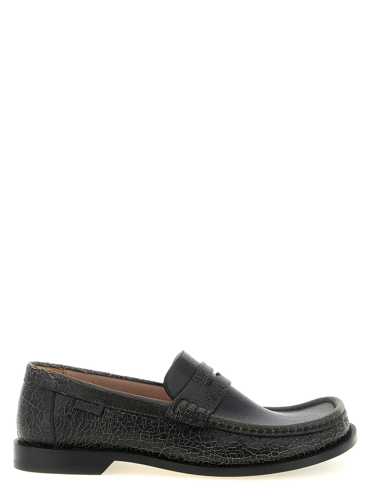 Elevate your wardrobe with Loewe's Black Calfskin Slip-On Loafers, a masterpiece of Italian craftsmanship that embodies timeless elegance and unparalleled comfort.