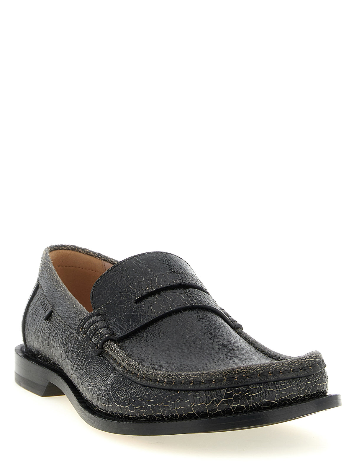 Discover the Loewe Black Calfskin Slip-On Loafers, where exquisite craftsmanship meets timeless elegance, perfect for the discerning individual seeking unparalleled luxury.