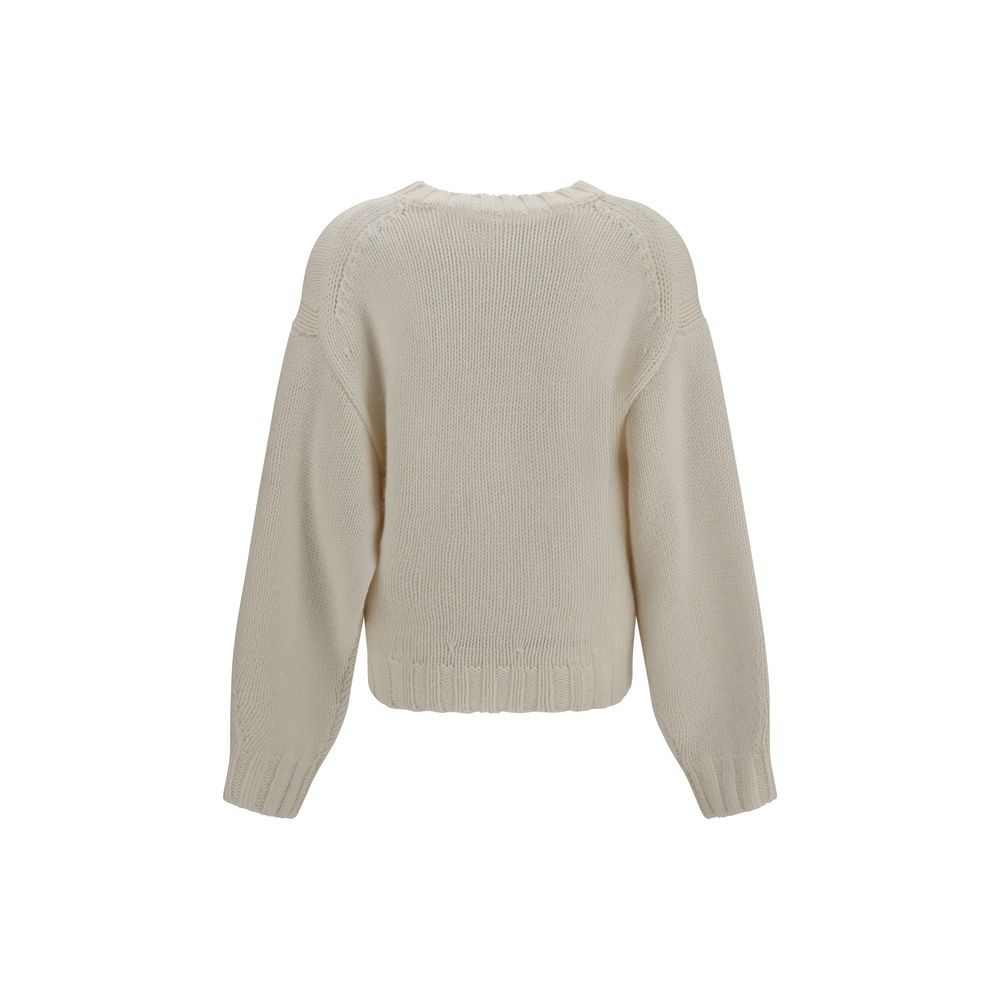 Indulge in the Khaite Beige Cashmere Sweater, a luxurious blend of 100% cashmere, redefined for effortless elegance and timeless sophistication in every moment.