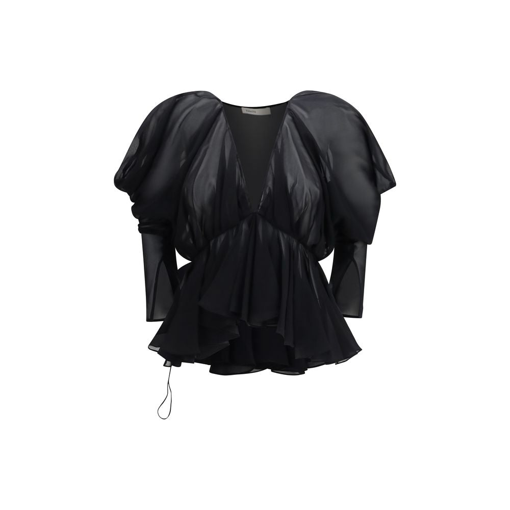 Elevate your wardrobe with the Khaite Black Silk Blouse, a masterpiece of lightweight silk chiffon, exuding elegance and sophistication for every refined occasion.