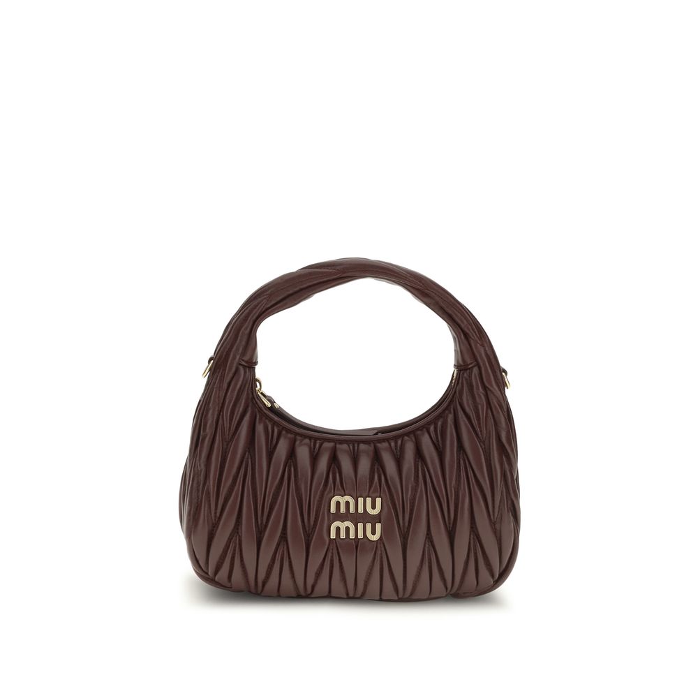 Indulge in the Miu Miu Bordeaux Calf Leather Bos Taurus Shoulder Bag, a luxurious blend of exquisite craftsmanship and timeless elegance, perfect for the discerning connoisseur.