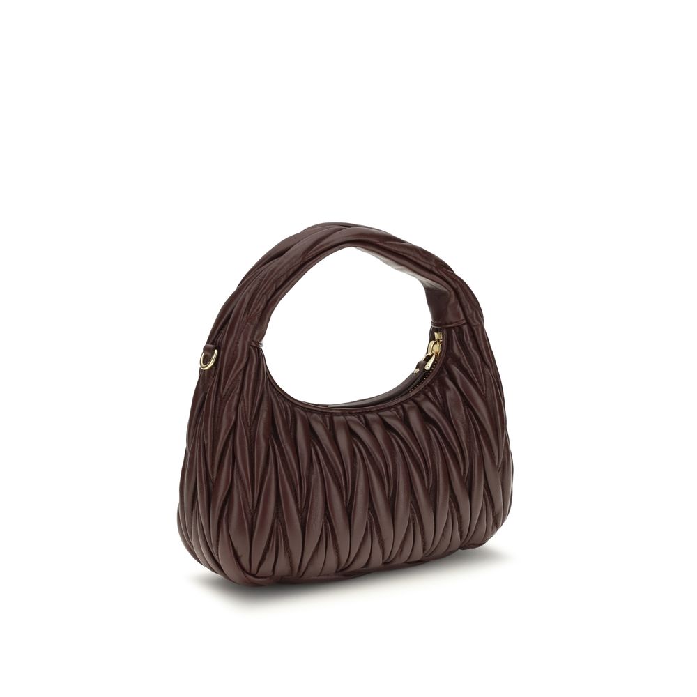 Elevate your style with the Miu Miu Bordeaux Calf Leather Bos Taurus Shoulder Bag, a masterpiece of exquisite craftsmanship and timeless elegance, perfect for discerning connoisseurs.