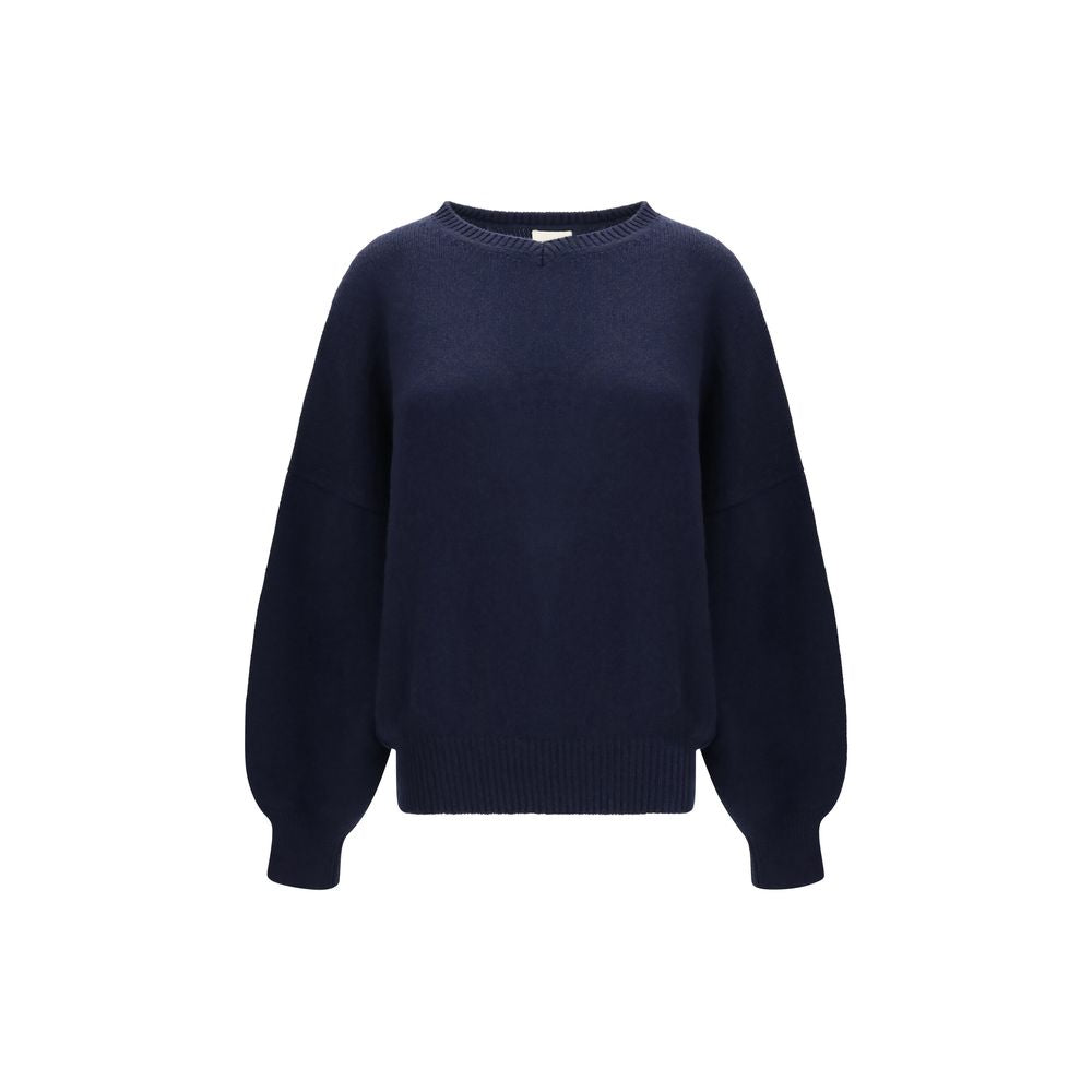 Experience the exquisite allure of the Khaite Blue Cashmere Sweater, a timeless piece crafted from luxurious cashmere, embodying elegance and sophistication for every occasion.