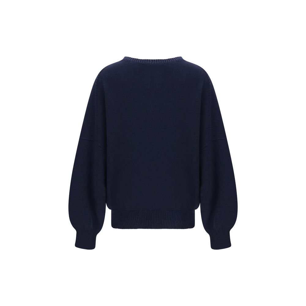 Experience the allure of Khaite's Blue Cashmere Sweater, a masterpiece of luxurious craftsmanship and timeless elegance, perfect for any sophisticated occasion.