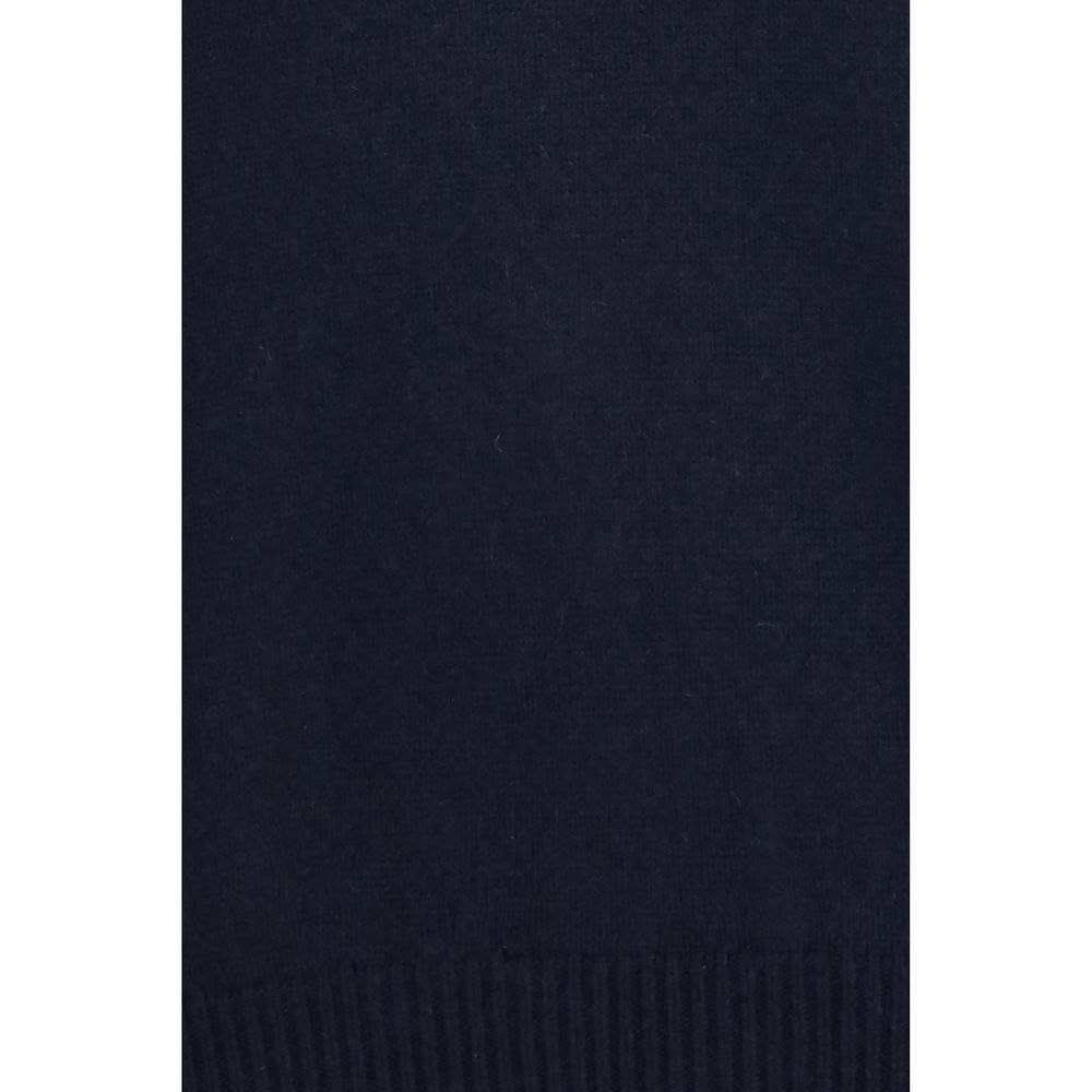 Experience the allure of Khaite's Blue Cashmere Sweater, a masterpiece of 100% cashmere craftsmanship that embodies timeless elegance and sophisticated style for every occasion.
