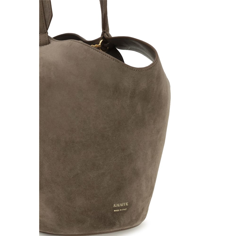 Indulge in the Khaite Brown Calf Leather Bos Taurus Shoulder Bag, a masterpiece of artisanal craftsmanship and luxurious suede, perfect for the discerning individual.