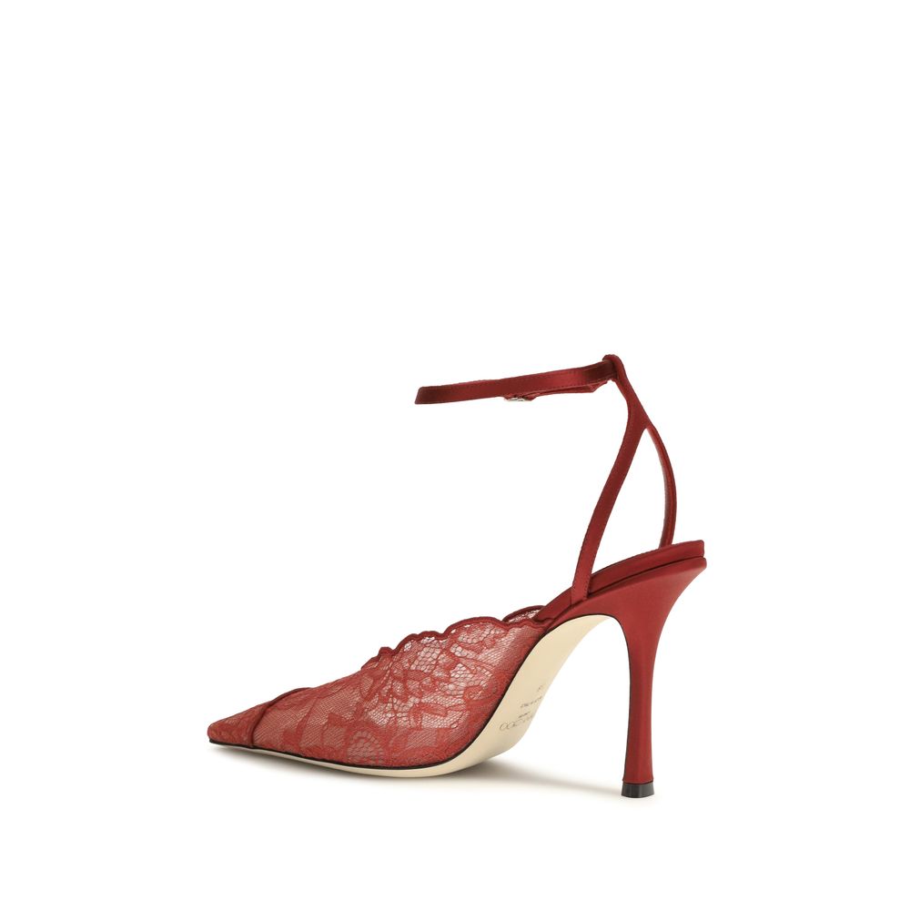 Experience the allure of Jimmy Choo's Red Fabric High Heel Pumps, where exquisite metallic lace and Italian craftsmanship elevate your elegance for every occasion.