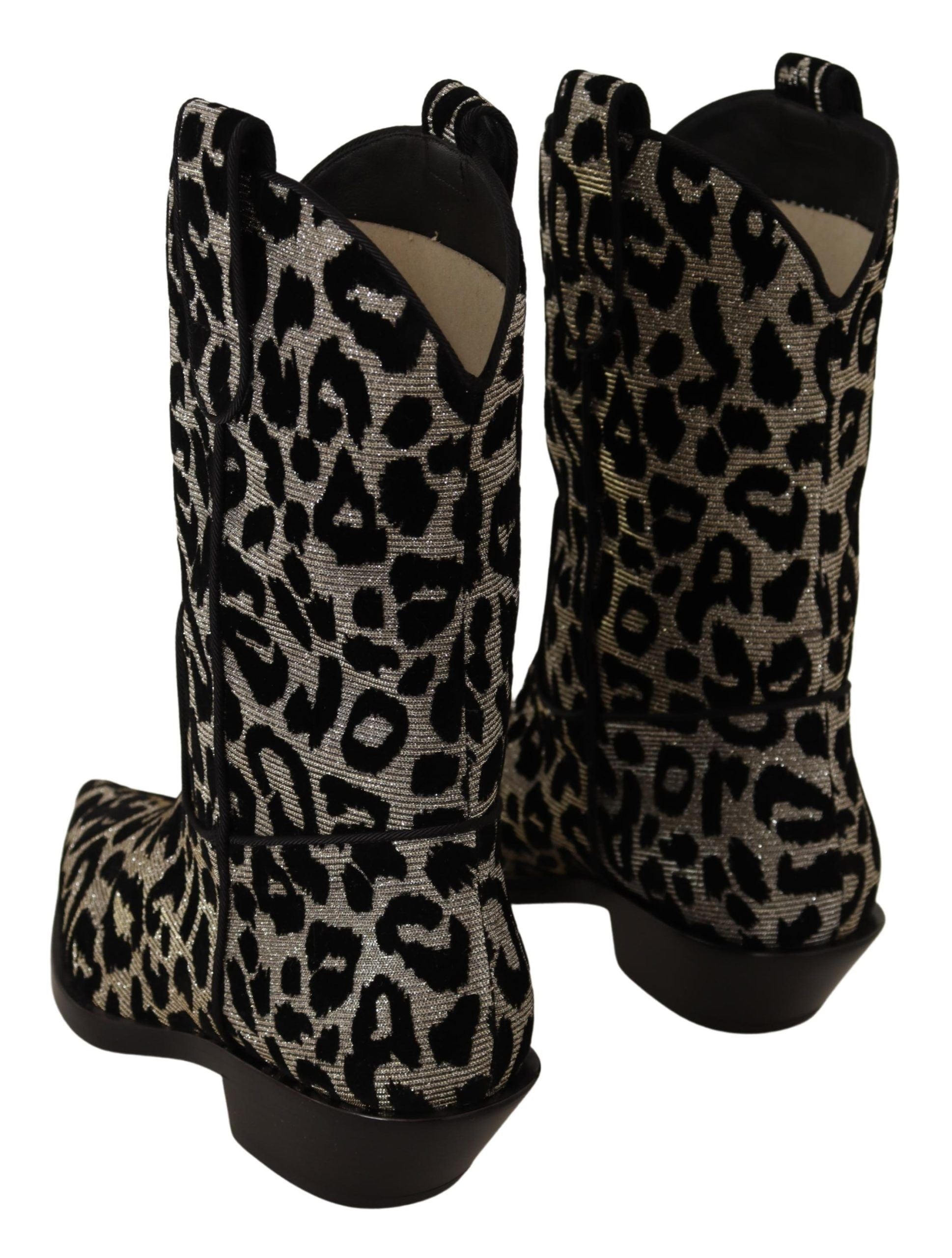 Step into a realm of opulence with Dolce & Gabbana's Gray Black Leopard Cowboy Boots, where exquisite Italian craftsmanship meets bold luxury for the discerning individual.