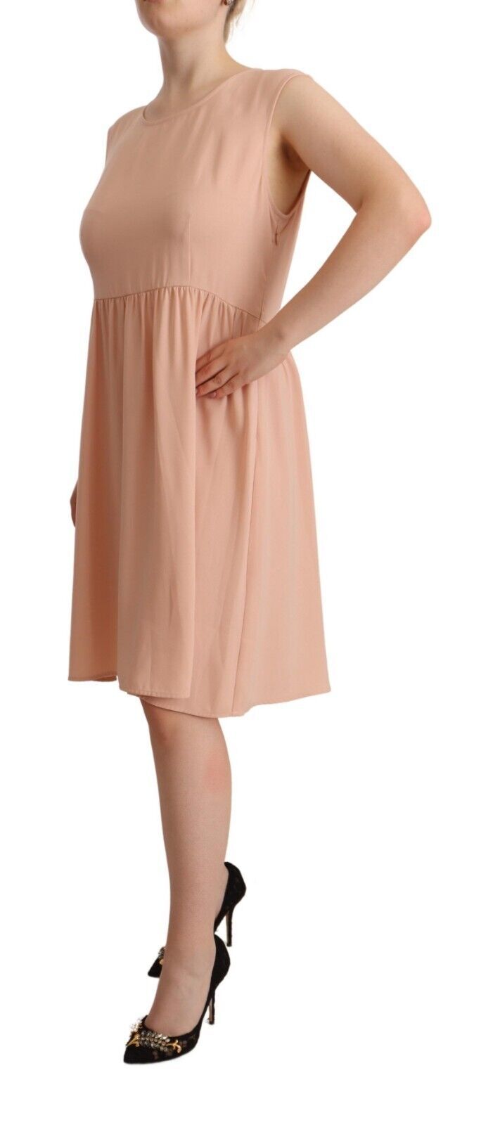 Indulge in the exquisite elegance of Twinset's Beige Polyester Sleeveless Shift Dress, where luxurious craftsmanship meets timeless allure for the discerning individual.