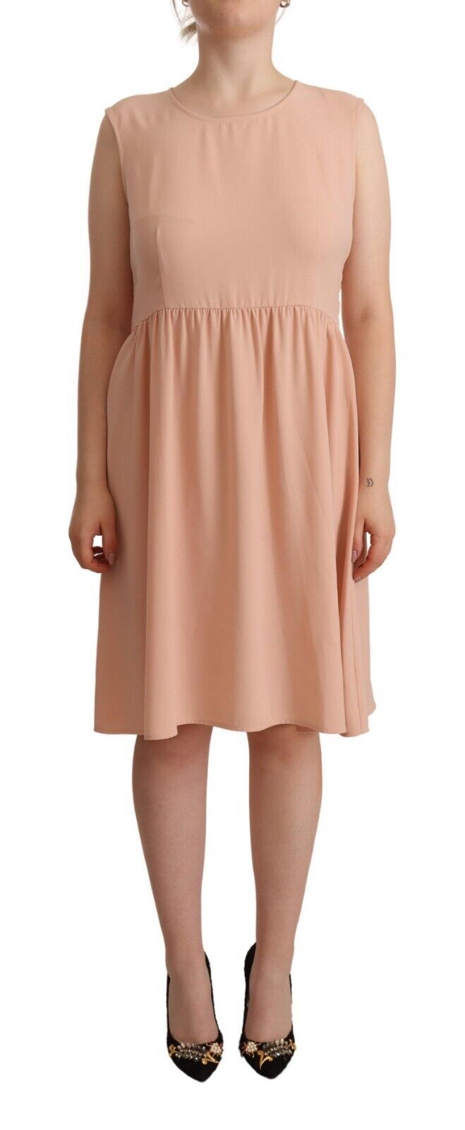 Experience the allure of Twinset's Beige Polyester Sleeveless Shift Dress, a masterpiece of luxurious craftsmanship that embodies timeless elegance and sophistication.