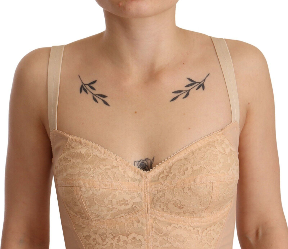 Indulge in the exquisite Dolce & Gabbana Beige Nylon Floral Lace Bodysuit, a testament to Italian craftsmanship that elevates your allure and sophistication for every occasion.