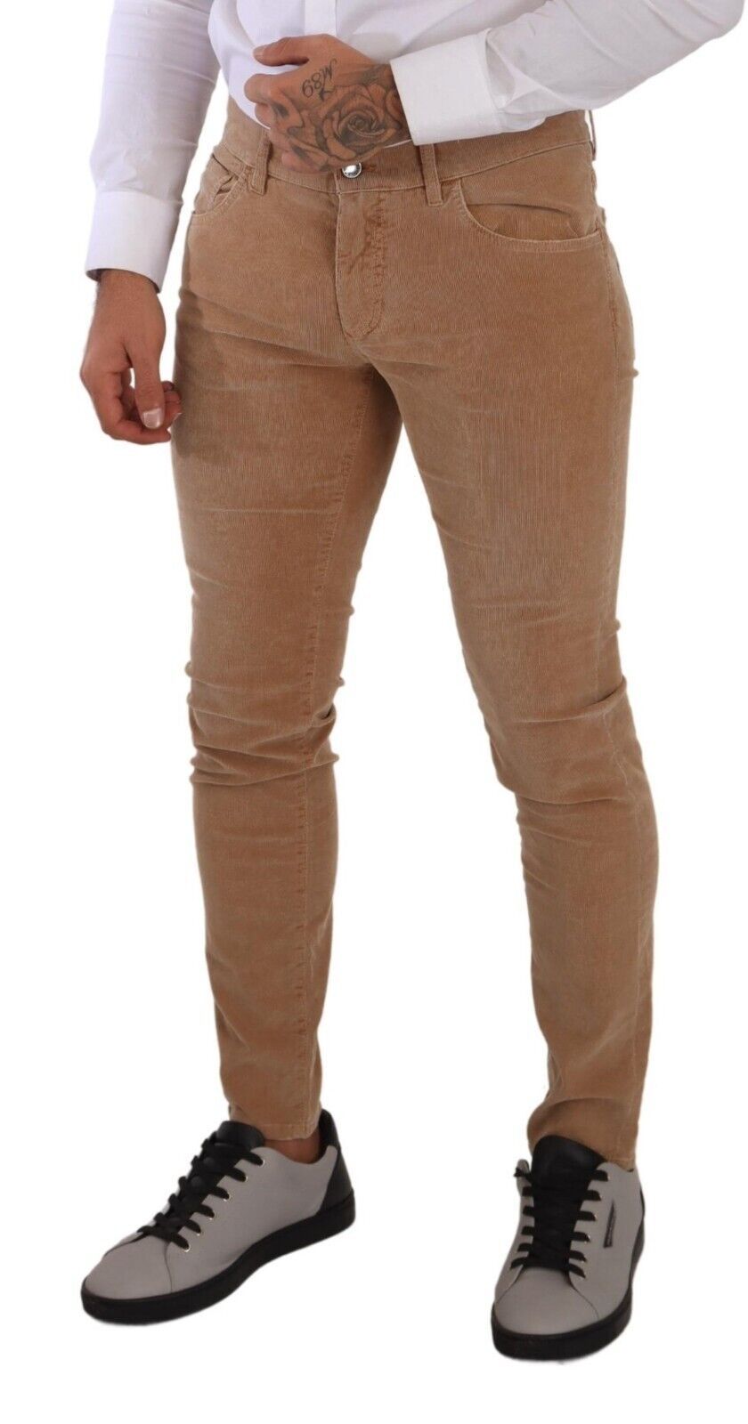 Indulge in the luxurious allure of Dolce & Gabbana's Brown Corduroy Cotton Skinny Slim Fit Jeans, where exquisite craftsmanship meets sophisticated style for the discerning individual.