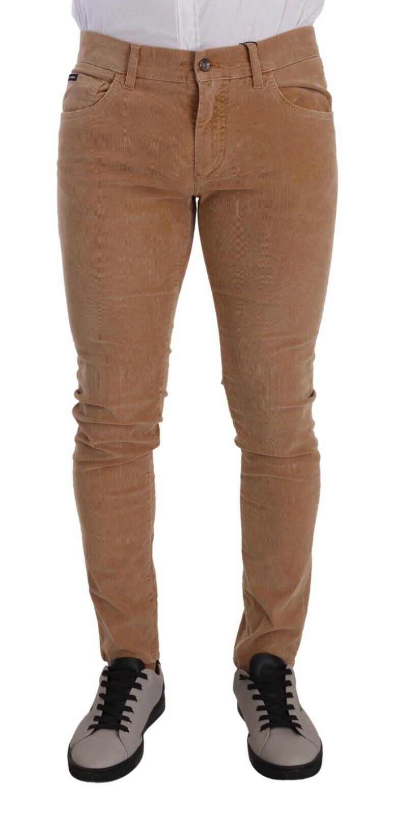 Indulge in the luxurious allure of Dolce & Gabbana's Brown Corduroy Cotton Skinny Slim Fit Jeans, where exquisite craftsmanship meets sophisticated style for the discerning individual.