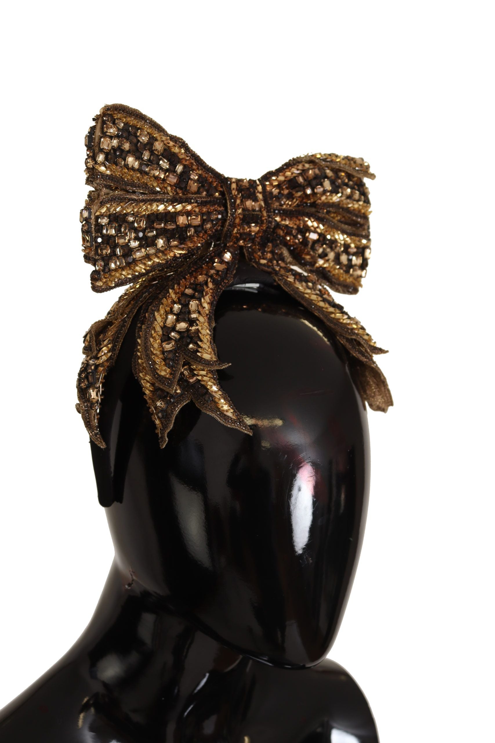 Indulge in the opulence of the Dolce & Gabbana Gold Crystal Beaded Silk Bow Headband, a handcrafted masterpiece that embodies exquisite Italian artistry and timeless elegance.