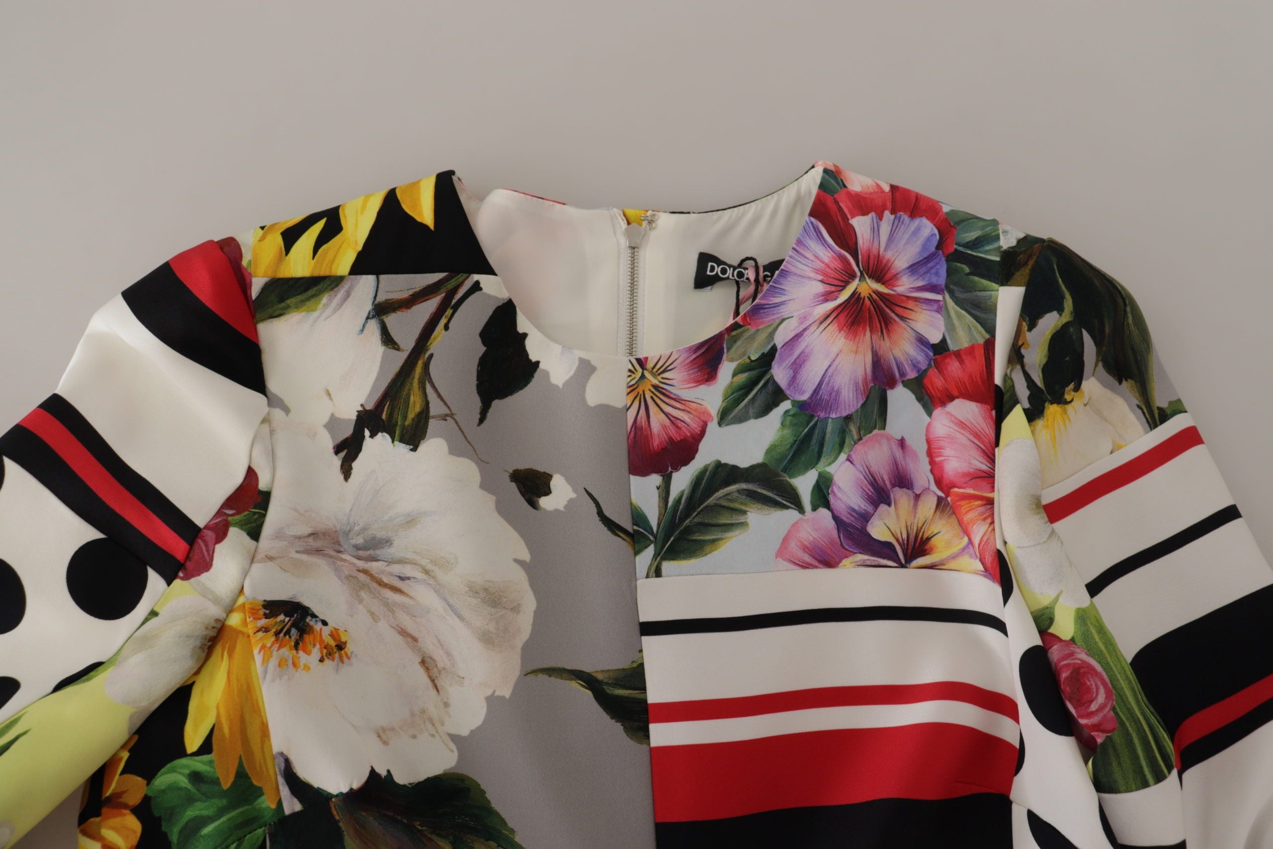 Experience the allure of the Dolce & Gabbana Multicolor Charmeuse Floral Sheath Dress, a masterpiece of exquisite craftsmanship and vibrant elegance, perfect for unforgettable moments.
