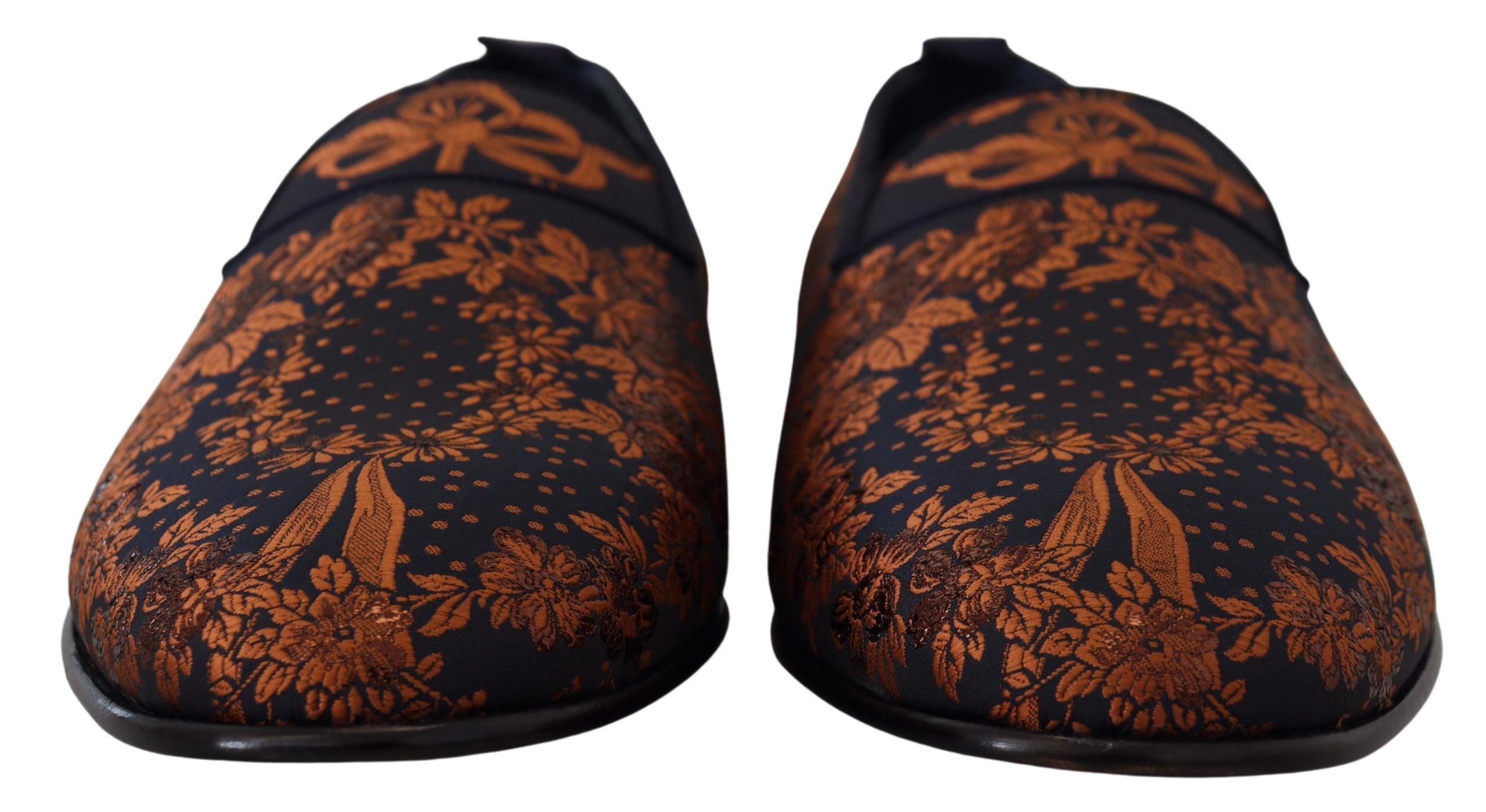 Elevate your style with Dolce & Gabbana's Blue Rust Floral Slippers, where exquisite craftsmanship meets luxurious comfort, perfect for the discerning individual.